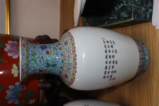 A pair of Chinese famille rose vases and another similar (3) Height 36cm